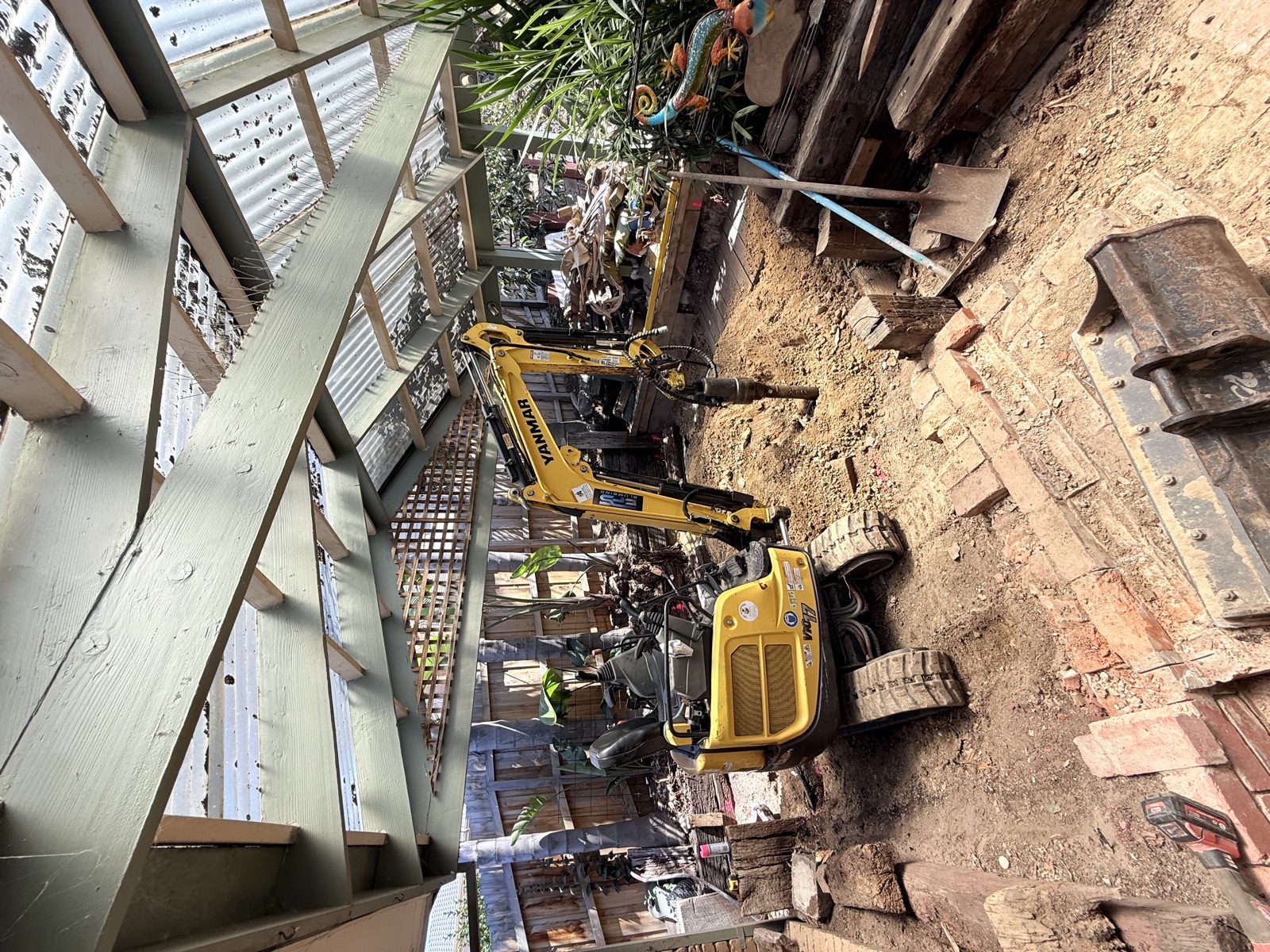 Excavation underway beneath the existing pergola at Kempston Street